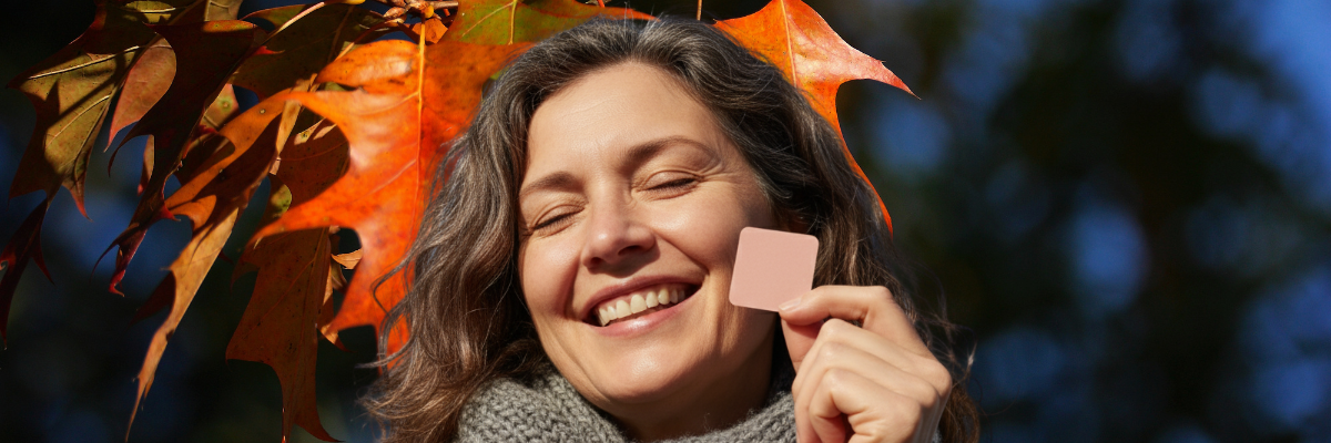 Woman holding transdermal patch 